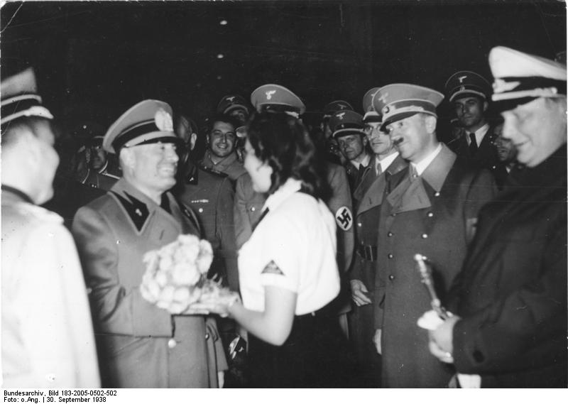 Benito Mussolini receives flowers from a BDM girl in Munich's station